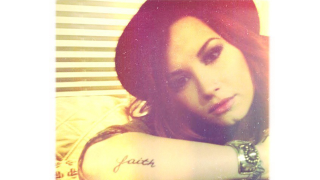 Illustration for article titled Demi Lovato Reveals New George Michael-Inspired Tattoo